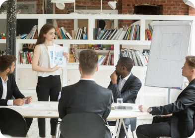 Business meeting with woman presenting a chart.